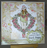 Card with the wreath girl colored over floral patterned paper, 'making my heart happy.'