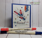 Navy-matted card with the feathers in coral, purple and teal with gold accents and the forward is the only way through arrow sentiment.