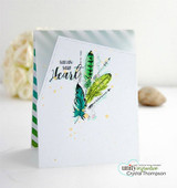 Card with the feathers in teal and green over a striped panel with yellow splatters and the follow your heart sentiment.