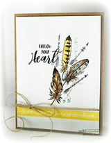 Kraft-backed card with the feathers in gold and teal, twine, and the follow your heart sentiment above a yellow strip.