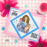 On Company Time, October 2026 Whit Kit sample card: the woman with the coffee cup in a blue diamond frame on pink hearts with The office won't gossip about itself