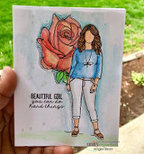 Watercolored card of the girl in a green top holding a coral rose, 'you can do hard things'.