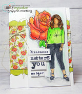 Card of the girl in a green sweater with an orange rose and 'kindness matters, you matter' word tiles.
