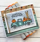 Card with a teal vintage truck loaded with pumpkins and 'GIVE THANKS.'