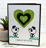 Handmade card with two panda bears mirrored beside a green heart, with "I think of you often."