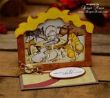 Dimensional stable die-cut card holding the Unto Us nativity scene above the sentiment 'unto us a child is born'.