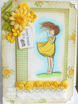 The dandelion girl in a yellow dress framed in green with a yellow paper flower and 'every breath is a gift.'
