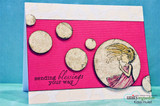The dandelion girl small on a pink panel over blue with 'sending blessings your way.'