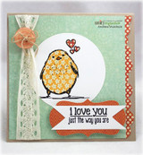 Mint green card with a yellow patterned bird on a white circle, lace ribbon, and the sentiment 'i love you just the way you are'