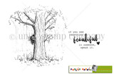 Stamp sheet for See Something Beautiful: a sketchy leafy tree with a girl peeking out from behind the trunk in tall grass, and the sentiment 'if you see something beautiful in someone, speak it.'