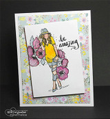 Handmade card featuring the fashionable AngieGirl gathering an armful of poppies, on floral patterned paper, stamped with 'Be amazing'.