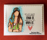 Cream scalloped card with Indie Girl coloured in green and turquoise beside 'we all have a purpose FIND IT. embrace it. OWN IT. live it.' and a small pink heart.