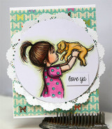 Card with the girl in a magenta dress and golden puppy inside a circle die cut over a white doily and mint patterned paper, 'love ya' stamped on a small white label.