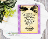 Purple-framed gold tag card with the full graduate blessing and black tassel bow.