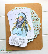 The winter girl colored in a purple scarf on a kraft card with 'We are like snowflakes all different in our own beautiful way.'