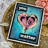 Deep blue and teal inked card with a pink swirled heart, white splatters and the words 'you' and 'matter' on black strips.