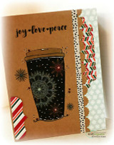 Kraft card with a snowflake travel mug and washi strips and 'joy love peace.'