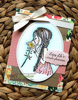 The braided girl in an oval on a floral card with 'Enjoy Life's simple pleasures.'