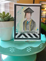 Graduate in a gray cap and gown on a card with 'Congratulations, couldn't be more proud of you.'