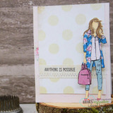 Card with the girl in a floral jacket on a polka-dot background, 'Anything is possible.'