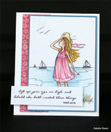 Blue matted card with the girl in a pink dress and the verse on a white strip