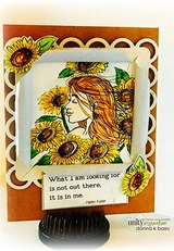 Card with the girl's red-orange hair and yellow sunflowers in a framed window over scalloped kraft layers, sentiment 'What I am looking for is not out there, it is in me.'