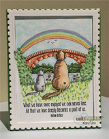 Stamp-edge framed card of the dog and cat under a watercolor rainbow
