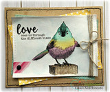 Kraft and gold layered card with the songbird coloured in rainbow watercolour on a stitched panel, twine bow, sentiment 'love sees us through the difficult times'.