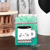 Teal coffee gift card holder with the white smiling mug and pink twine, a gift card peeking out the top.