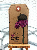 Kraft gift tag with a purple-and-brown Soul Joy coneflower and a 'you make me feel loved all over' sample sentiment.