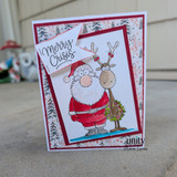 Whimsical Christmas card featuring Santa, a reindeer, and the humorous sentiment "Merry Crisis."