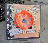 Peach and black card with an ornate white frame around a peach fabric flower with a rhinestone center and 'you are you and that is all that MATTERS.'
