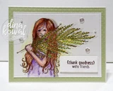 Sample card with the girl colored in purple with auburn hair holding green sprigs on a pale green embossed card with a sentiment label.