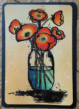 Navy framed card with a warm tan blended background, the poppies coloured in orange and red in a turquoise jar over the heavy black brushstroke base.