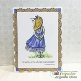 Sample card with the girl in a periwinkle dress on a white panel inside a kraft doily-edged frame with 'Simplicity is the ultimate sophistication.'