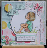 The sitting girl colored in a teal top in a circle over patterned papers with 'my heart is with you today and every day.'
