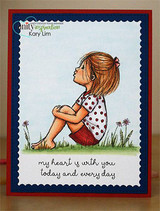 The sitting girl in a red top on a blue panel matted in red with 'my heart is with you today and every day.'