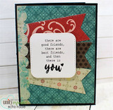The 'there are good friends... and then there is you' sentiment framed on a teal-and-red flag card.