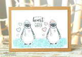 Kraft card with two Mittens in Winter penguins standing on a strip of blue snow.