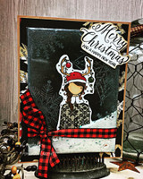 Card with the girl in a Santa hat and antlers, buffalo-check bow and 'Merry Christmas.'