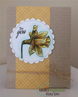 Kraft card with a plaid strip and a scalloped circle holding the single yellow daffodil and 'Be you'