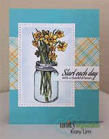 Aqua card with plaid paper and the mason jar of golden daffodils beside 'Start each day with a thankful heart.'