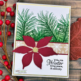 Card with green pine boughs and a red poinsettia, "May this Winter bring peace & serenity," red berries