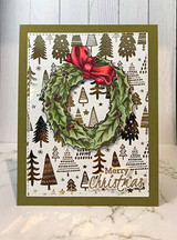 Olive card with a tree-print panel, the wreath stamped in soft green with a red bow, sentiment 'Merry Christmas' in gold script.