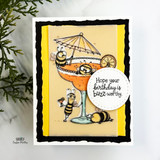 Whimsical bee birthday card with bees enjoying a cocktail and a “Hope your birthday is buzz-worthy” sentiment.