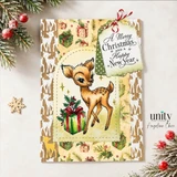 Dashing Deer Delivery, October 2026 Uniquely Unity sample card: the fawn and gift on cream patterned paper with a scalloped tag, straight on