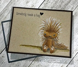 Kraft card of the porcupine sitting on a sketched ground line, 'Somebody needs a hug.'