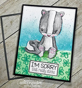 Card with the skunk colored gray over a green and teal panel, 'I'm sorry that really stinks'