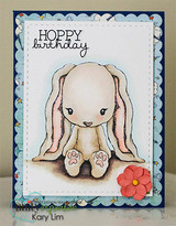 Handmade card featuring the floppy-eared Cuddlebug bunny sitting sweetly, matted with a scalloped oval, stamped with 'My heart gets all flip-floppy when I think of you'.
