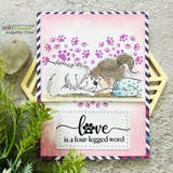 Paw-print stenciled card of the pair with 'love is a four-legged word' sentiment